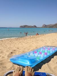 Scenic view of beach against blue sky