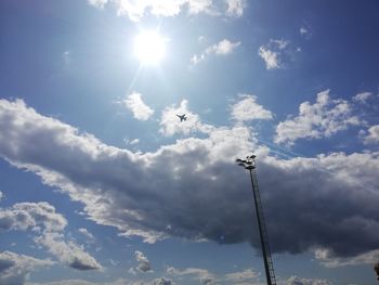 Low angle view of street light against sky on sunny day