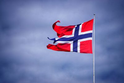 Low angle view of flag against sky