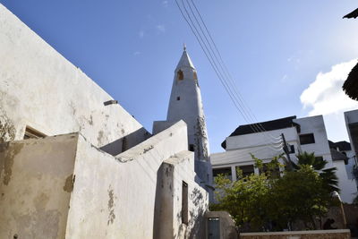 Low angle view of building against blue sky