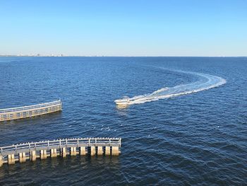 Scenic view of sea against clear blue sky