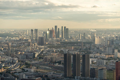 Aerial view of modern buildings in city against sky