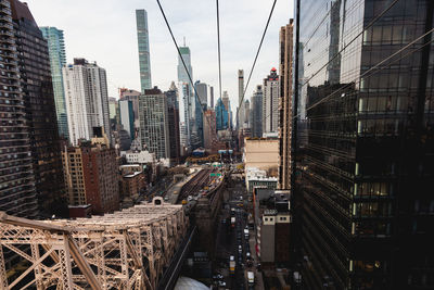 Panoramic view of buildings in city against sky