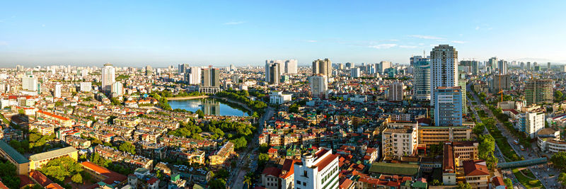 High angle view of modern buildings in city against sky