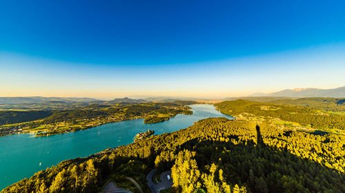 High angle view of sea against clear blue sky