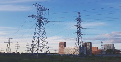 Low angle view of electricity pylon against sky