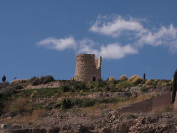 Low angle view of fort against blue sky