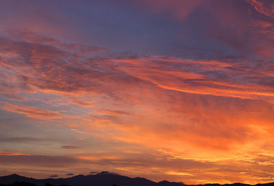 Low angle view of dramatic sky during sunset