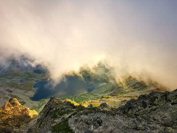 Mountain valley in the clouds lit by the setting sun. tatra mountains slovakia.