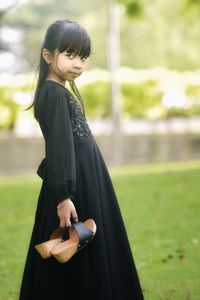 Young woman smiling in park