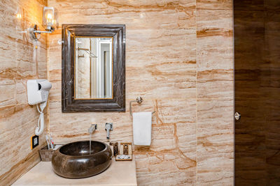 Close-up of faucet in bathroom at home