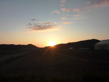 Scenic view of landscape at sunset