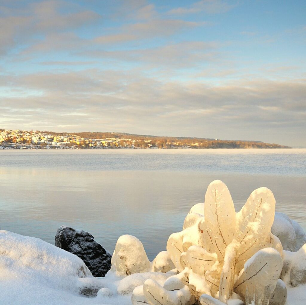 snow, winter, cold temperature, water, sky, tranquil scene, scenics, tranquility, beauty in nature, rock - object, weather, cloud - sky, nature, season, frozen, sea, lake, river, idyllic, cloud