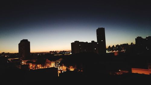 Silhouette of city at night