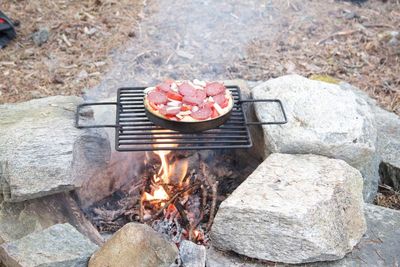 High angle view of meat on barbecue grill