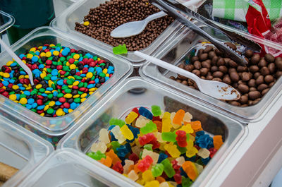 High angle view of multi colored candies in container