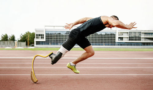 Full length of young man jumping