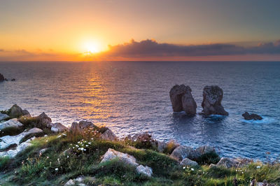 Scenic view of sea against sky during sunset