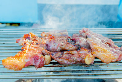 Close-up of meat on barbecue grill