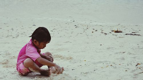 Boy playing on beach