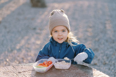 Portrait of cute girl holding ice cream cone