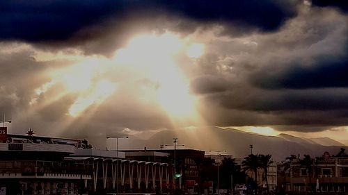 Panoramic view of city against dramatic sky