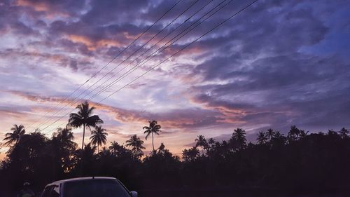 Low angle view of silhouette trees against sky during sunset