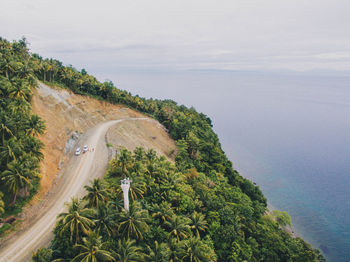 High angle view of road by sea against sky