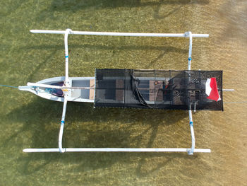 High angle view of boat on sandy beach