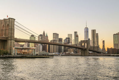 Bridge over river with buildings in background