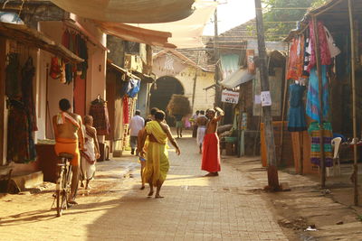 Rear view of people walking in store