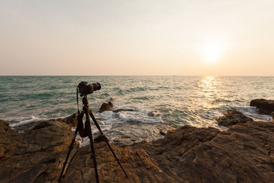 Scenic view of sea against clear sky during sunset