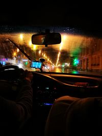 Man driving car on road at night