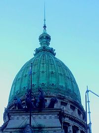 Low angle view of church against blue sky