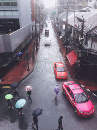 High angle view of vehicles on road in city