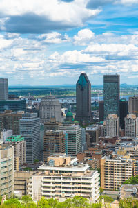 Buildings in city against sky