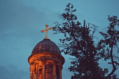 Low angle view of bell tower against sky