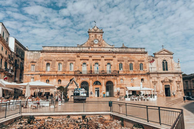 Group of people in front of historical building