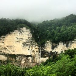 Scenic view of tree mountains against sky