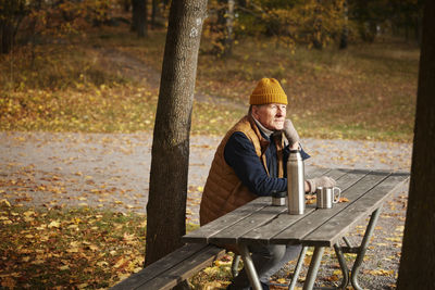 Senior man at picnic table in park