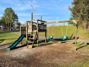 Empty playground against clear sky in park