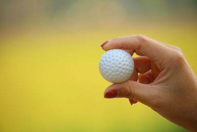 Close-up of hand holding ball