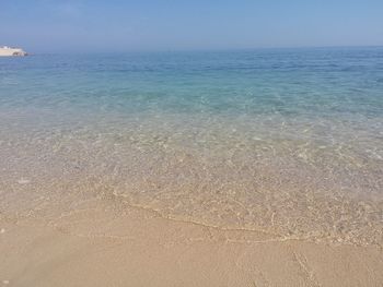 Scenic view of sea against blue sky