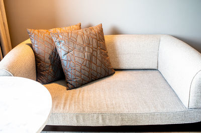 Close-up of sofa on table at home
