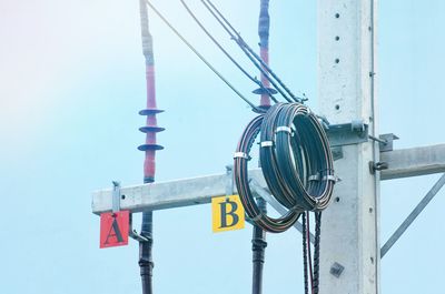 Low angle view of cables against clear sky