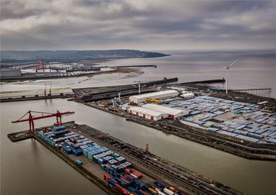 High angle view of harbor by sea against sky