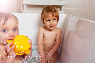 High angle view of young woman in bathtub