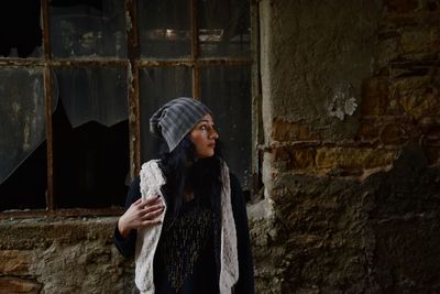 Young woman standing at night