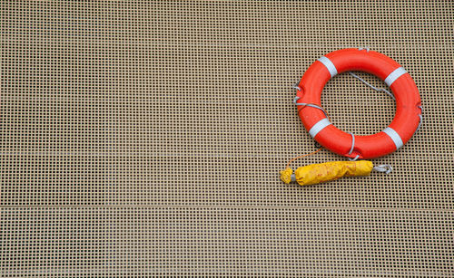 Directly above shot of orange bell on floor