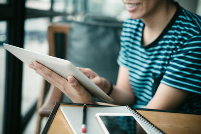 Close-up of woman using mobile phone